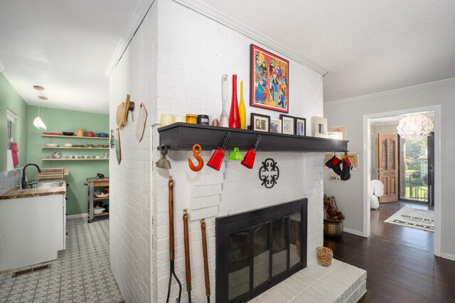 100 Pine Cone Ln, Chattanooga, TN 37415 - detailed view of ornamental molding, a fireplace, and wood finished floors