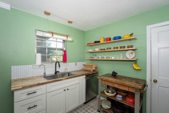 100 Pine Cone Ln, Chattanooga, TN 37415 - kitchen with wood counters, stainless steel dishwasher, decorative backsplash, open shelves, and white cabinets
