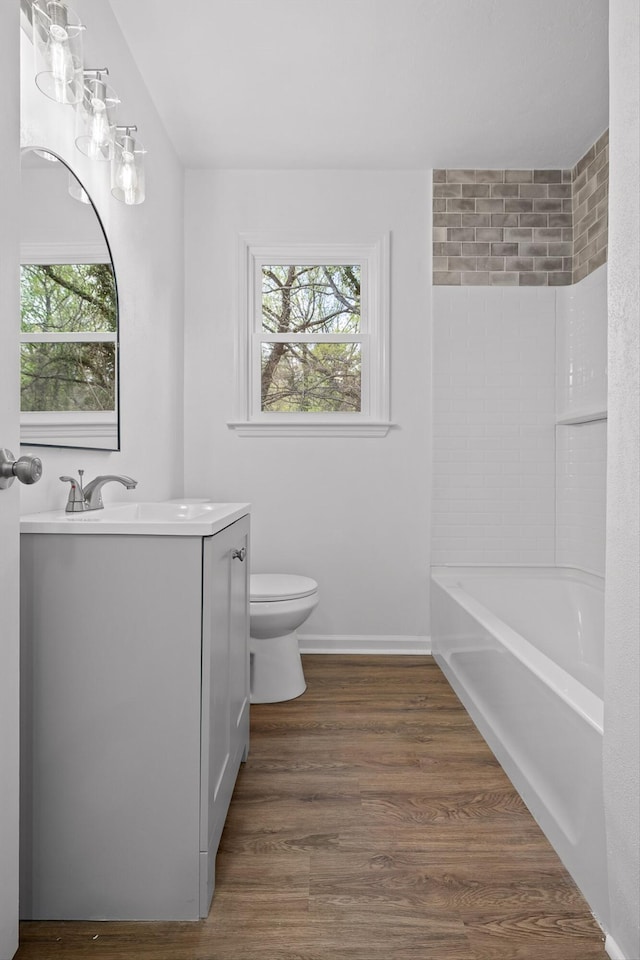3002 Peggy Ln, Chattanooga, TN 37404 - full bath featuring vanity, healthy amount of natural light, wood finished floors, and shower / bathtub combination