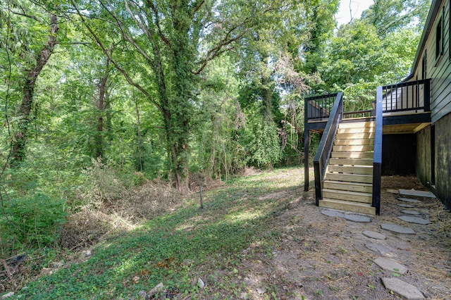 3002 Peggy Ln, Chattanooga, TN 37404 - view of yard with stairs, a wooden deck, and a view of trees