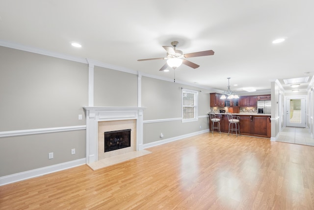 3609 Brass Lantern Way, Chattanooga, TN 37415 - living area with ornamental molding, ceiling fan, a premium fireplace, recessed lighting, and light wood-style floors