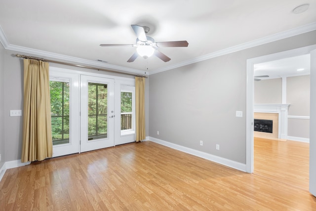 3609 Brass Lantern Way, Chattanooga, TN 37415 - unfurnished room featuring ceiling fan, light wood finished floors, crown molding, a fireplace with flush hearth, and a smoke detector