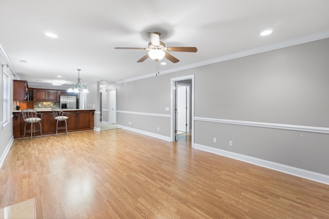 3609 Brass Lantern Way, Chattanooga, TN 37415 - unfurnished living room featuring a ceiling fan, a chandelier, crown molding, recessed lighting, and light wood finished floors