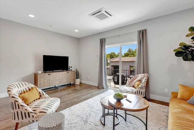 280 W 16th St, Chattanooga, TN 37408 - living room featuring wood finished floors, a baseboard heating unit, and recessed lighting