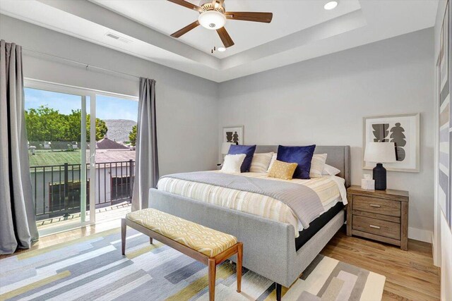 280 W 16th St, Chattanooga, TN 37408 - bedroom with access to outside, a tray ceiling, light wood-style floors, recessed lighting, and a ceiling fan