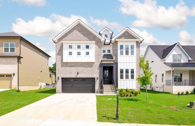 8340 Snowdrop Way, Ooltewah, TN 37363 - view of front facade with brick siding, driveway, a garage, a front lawn, and board and batten siding