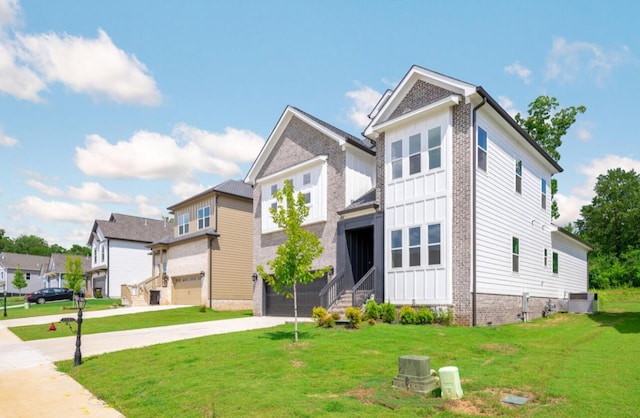 8340 Snowdrop Way, Ooltewah, TN 37363 - view of front facade featuring concrete driveway, a garage, a front lawn, and a residential view