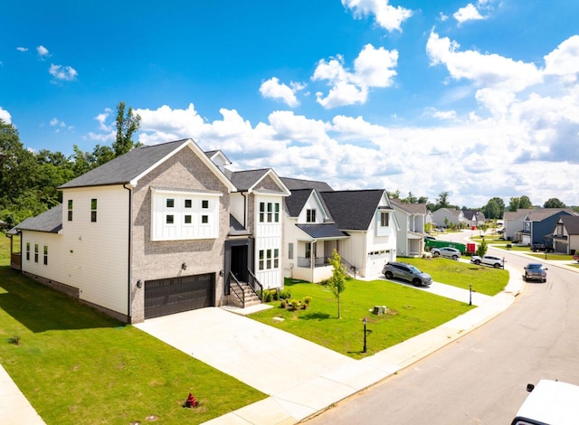 8340 Snowdrop Way, Ooltewah, TN 37363 - modern farmhouse featuring a garage, driveway, a residential view, a front yard, and brick siding