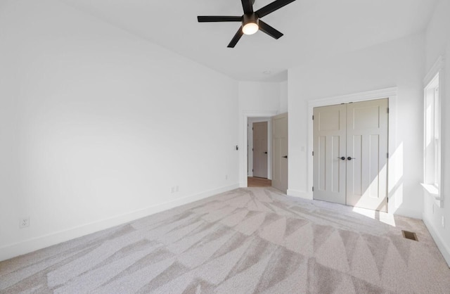8340 Snowdrop Way, Ooltewah, TN 37363 - unfurnished bedroom with light carpet, a closet, and ceiling fan