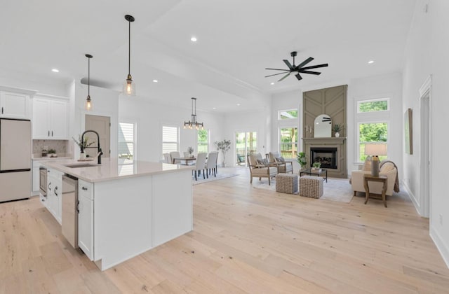 8340 Snowdrop Way, Ooltewah, TN 37363 - kitchen featuring white fridge, white cabinetry, a ceiling fan, light wood finished floors, and light countertops