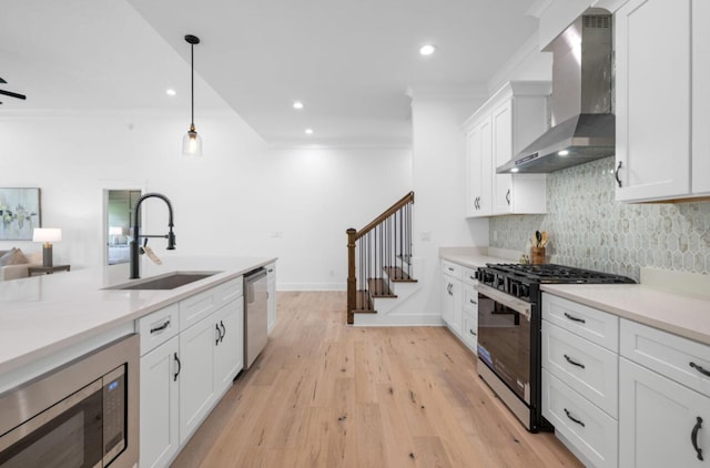 8340 Snowdrop Way, Ooltewah, TN 37363 - kitchen with wall chimney exhaust hood, stainless steel appliances, tasteful backsplash, ornamental molding, and white cabinetry