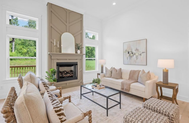 8340 Snowdrop Way, Ooltewah, TN 37363 - living room featuring light wood finished floors, a fireplace, and recessed lighting