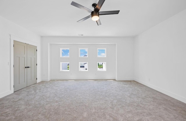 8340 Snowdrop Way, Ooltewah, TN 37363 - unfurnished bedroom featuring carpet, a ceiling fan, and a closet