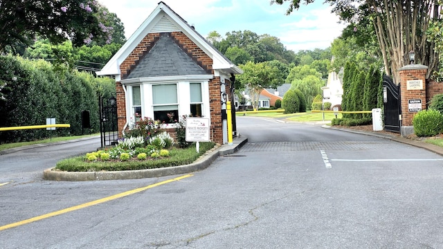 1103 Centennial Dr, Chattanooga, TN 37405 - view of asphalt street featuring curbs, street lights, and a gated entry