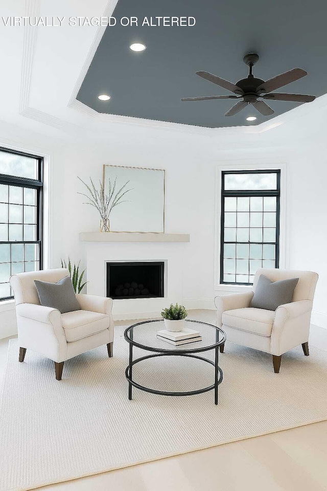 1103 Centennial Dr, Chattanooga, TN 37405 - living room featuring recessed lighting, a fireplace, ceiling fan, a tray ceiling, and ornamental molding
