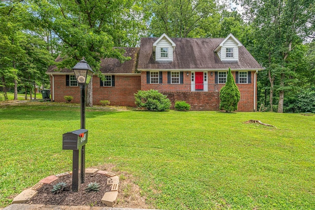 848 Skyline Park Dr, Signal Mountain, TN 37377 - cape cod house with brick siding, a front yard, and view of wooded area