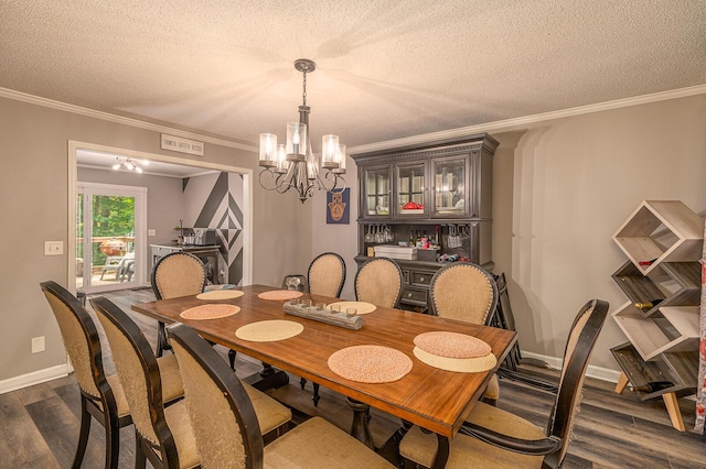 848 Skyline Park Dr, Signal Mountain, TN 37377 - dining space featuring dark wood-style flooring, ornamental molding, a chandelier, and a textured ceiling
