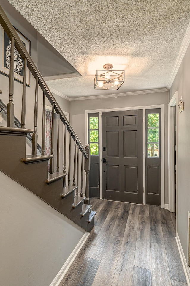 848 Skyline Park Dr, Signal Mountain, TN 37377 - foyer entrance featuring a textured ceiling, plenty of natural light, crown molding, wood finished floors, and stairway