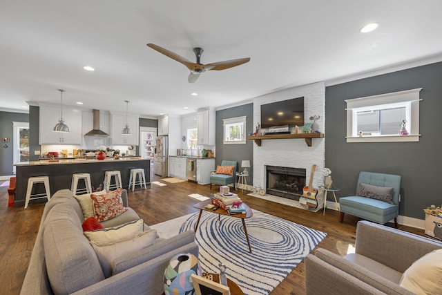 834 Dartmouth St, Chattanooga, TN 37405 - living room featuring ceiling fan, a fireplace, recessed lighting, and dark wood-style flooring