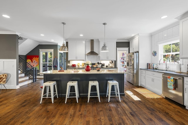 834 Dartmouth St, Chattanooga, TN 37405 - kitchen featuring stainless steel appliances, wall chimney exhaust hood, tasteful backsplash, dark wood finished floors, and recessed lighting