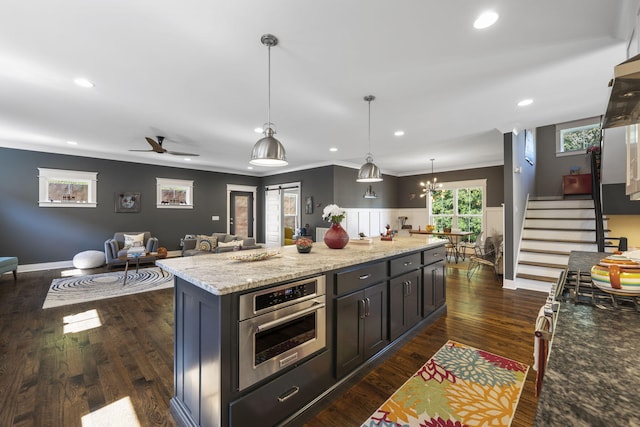 834 Dartmouth St, Chattanooga, TN 37405 - kitchen featuring ornamental molding, pendant lighting, dark wood finished floors, recessed lighting, and light stone counters