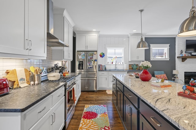834 Dartmouth St, Chattanooga, TN 37405 - kitchen with stainless steel appliances, wall chimney exhaust hood, white cabinetry, dark wood-type flooring, and recessed lighting