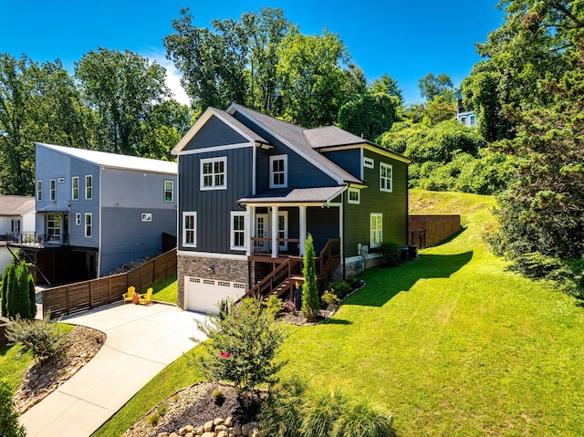 834 Dartmouth St, Chattanooga, TN 37405 - view of front of home with board and batten siding, a garage, stone siding, concrete driveway, and stairway