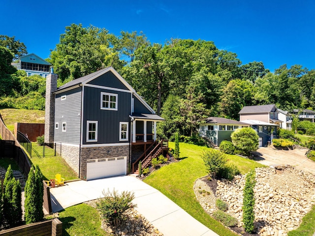 834 Dartmouth St, Chattanooga, TN 37405 - view of front of home featuring stairs, board and batten siding, concrete driveway, stone siding, and an attached garage