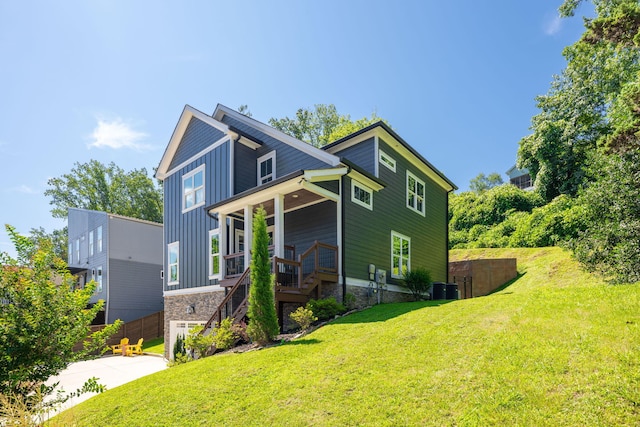 834 Dartmouth St, Chattanooga, TN 37405 - view of front of property featuring board and batten siding, concrete driveway, a front lawn, stairway, and stone siding