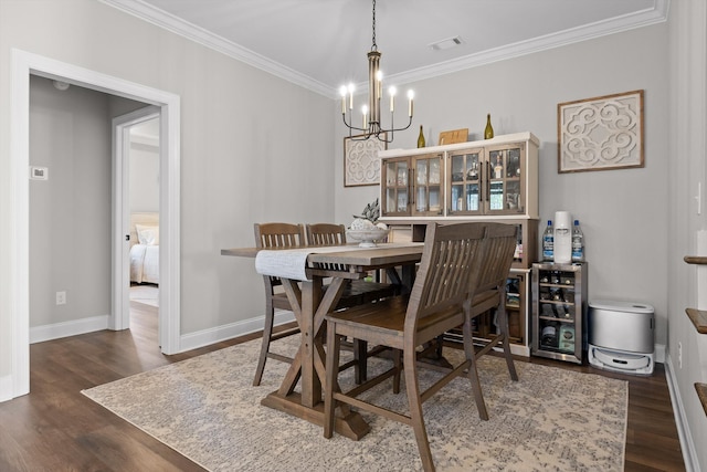 596 Nature Trl, Soddy Daisy, TN 37379 - dining area with crown molding, a chandelier, and dark wood-style floors
