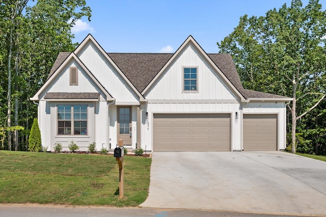 596 Nature Trl, Soddy Daisy, TN 37379 - modern farmhouse featuring a shingled roof, driveway, a front yard, and an attached garage