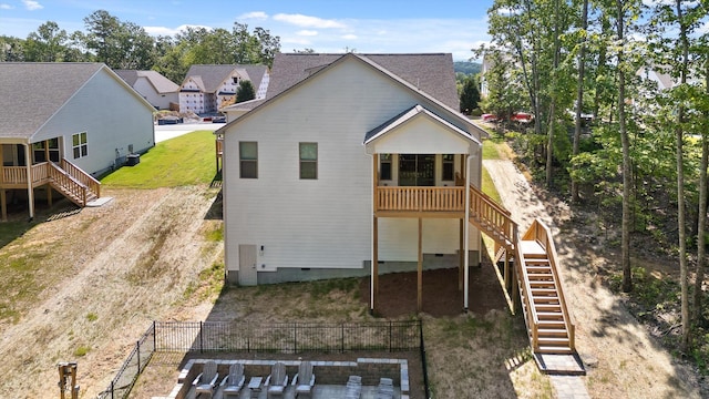 596 Nature Trl, Soddy Daisy, TN 37379 - back of property featuring stairs, crawl space, a sunroom, and a residential view