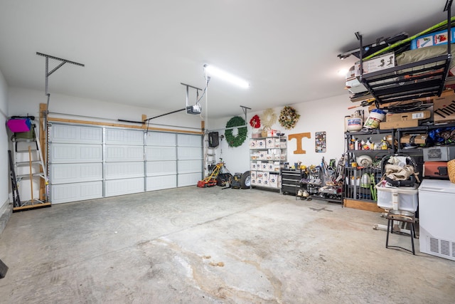 8520 Kensley Ln, Hixson, TN 37343 - garage with a garage door opener and washer / dryer