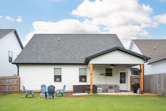 8520 Kensley Ln, Hixson, TN 37343 - rear view of house with a ceiling fan, a fenced backyard, a hot tub, outdoor lounge area, and a patio