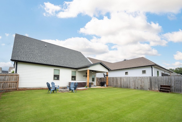 8520 Kensley Ln, Hixson, TN 37343 - back of property featuring a fire pit, a fenced backyard, and roof with shingles