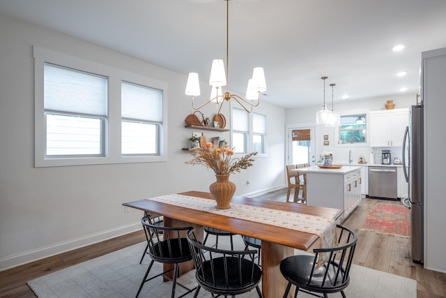 8520 Kensley Ln, Hixson, TN 37343 - dining room featuring light wood-style floors, a chandelier, and recessed lighting