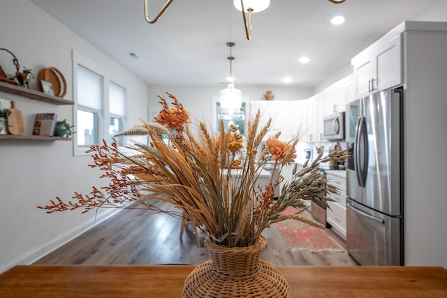 8520 Kensley Ln, Hixson, TN 37343 - detailed view of appliances with stainless steel finishes, wood finished floors, and recessed lighting