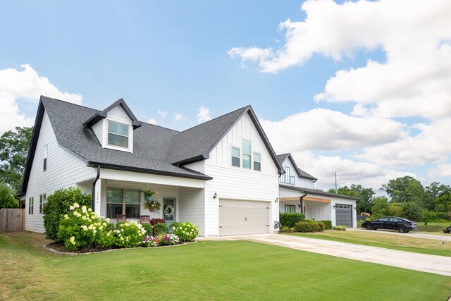 8520 Kensley Ln, Hixson, TN 37343 - modern inspired farmhouse featuring board and batten siding, concrete driveway, a garage, a porch, and a shingled roof