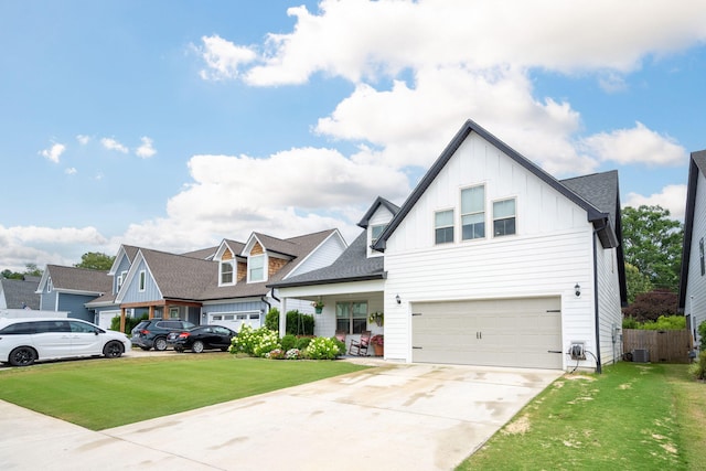 8520 Kensley Ln, Hixson, TN 37343 - modern farmhouse style home with board and batten siding, a garage, and concrete driveway