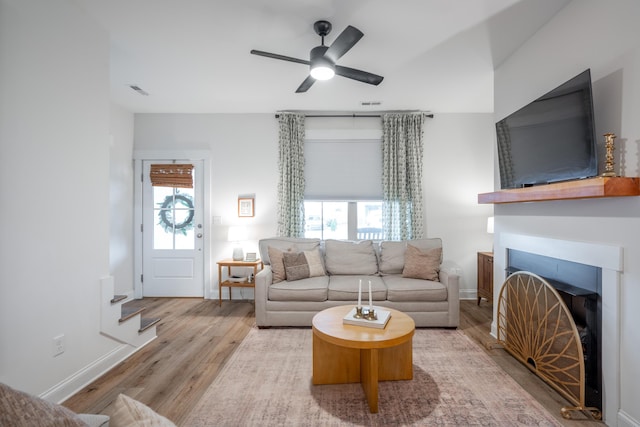 8520 Kensley Ln, Hixson, TN 37343 - living room with wood finished floors, a fireplace, and a ceiling fan