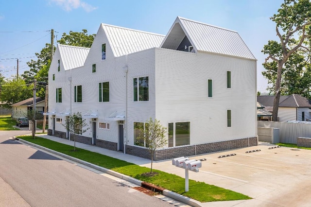 1310 Top St, Chattanooga, TN 37408 - view of side of home featuring uncovered parking and a metal roof
