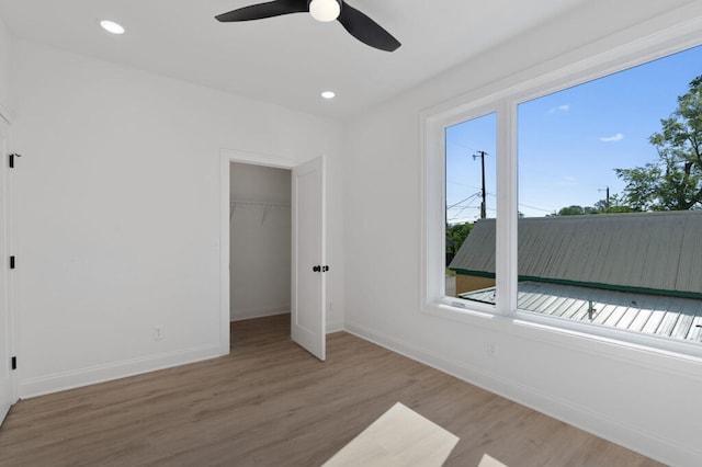 1310 Top St, Chattanooga, TN 37408 - unfurnished bedroom with wood finished floors, recessed lighting, ceiling fan, and a walk in closet