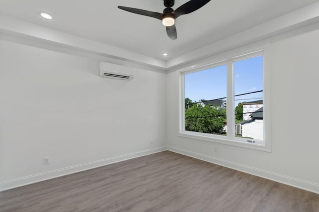 1310 Top St, Chattanooga, TN 37408 - unfurnished room featuring an AC wall unit, wood finished floors, a ceiling fan, and recessed lighting