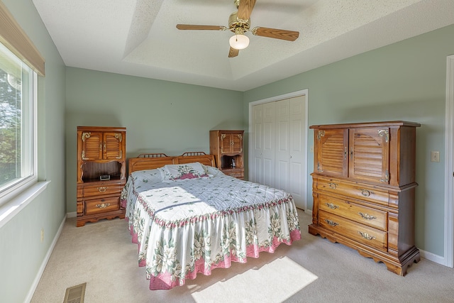 6134 Blue Ash Dr, Ooltewah, TN 37363 - bedroom with multiple windows, light colored carpet, a closet, and a tray ceiling