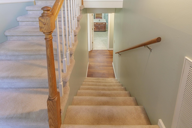 6134 Blue Ash Dr, Ooltewah, TN 37363 - stairway featuring wood finished floors and a heating unit
