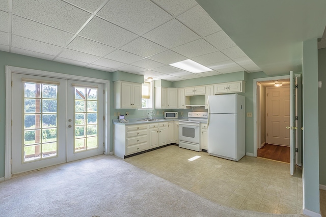 6134 Blue Ash Dr, Ooltewah, TN 37363 - kitchen with white appliances, french doors, a drop ceiling, white cabinets, and light countertops