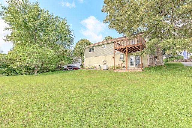 6134 Blue Ash Dr, Ooltewah, TN 37363 - back of property featuring a yard, a wooden deck, and stucco siding