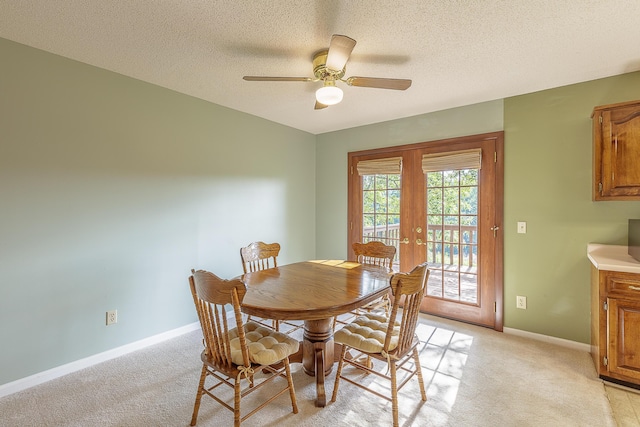 6134 Blue Ash Dr, Ooltewah, TN 37363 - dining area featuring french doors, light colored carpet, ceiling fan, and a textured ceiling
