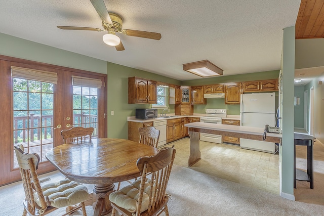 6134 Blue Ash Dr, Ooltewah, TN 37363 - dining space featuring light colored carpet, a textured ceiling, ceiling fan, and french doors