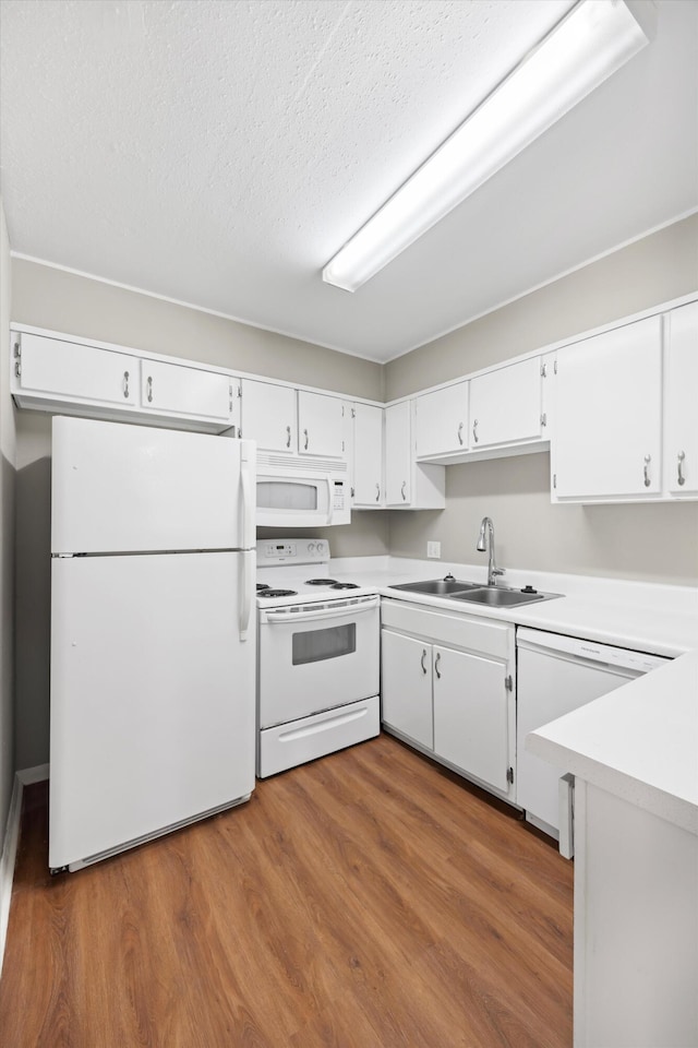 900 Mountain Creek Rd Unit V479, Chattanooga, TN 37405 - kitchen with white appliances, light countertops, white cabinets, wood finished floors, and a textured ceiling